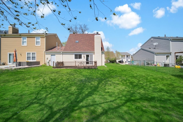 29W395 Greenbriar Ln, Warrenville, IL 60555 - rear view of property with a lawn, a wooden deck, fence private yard, and a chimney