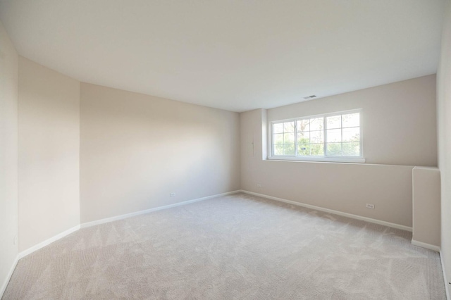 573 S Rosehall Ln Unit 0, Round Lake, IL 60073 - carpeted spare room with baseboards and visible vents