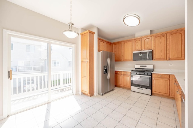 573 S Rosehall Ln Unit 0, Round Lake, IL 60073 - kitchen with light tile patterned flooring, pendant lighting, stainless steel appliances, and light countertops