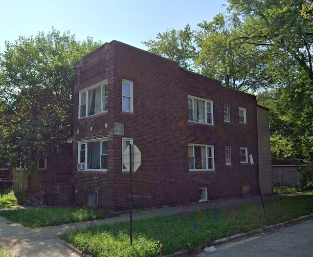 1301 E 73rd St, Chicago, IL 60619 - view of side of home with brick siding