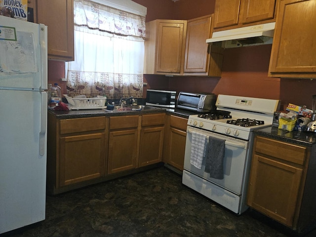 1301 E 73rd St, Chicago, IL 60619 - kitchen with white appliances, under cabinet range hood, a sink, dark floors, and dark countertops