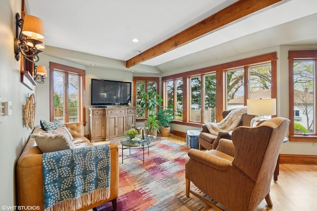 living room with beamed ceiling, a healthy amount of sunlight, baseboards, and recessed lighting