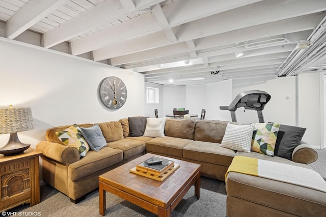 living room featuring beam ceiling and carpet