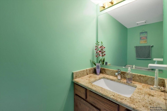 bathroom featuring visible vents and vanity