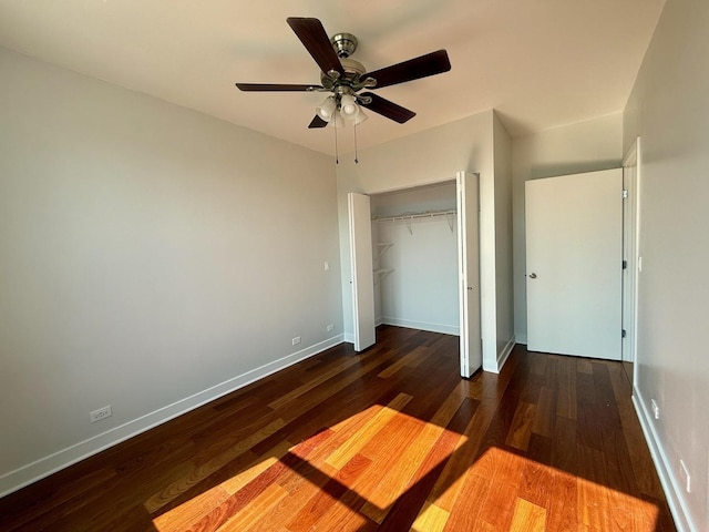 651 N Milwaukee Ave Unit 403, Chicago, IL 60642 - unfurnished bedroom with baseboards, wood finished floors, ceiling fan, and a closet