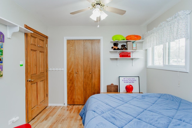 bedroom with a ceiling fan and wood finished floors