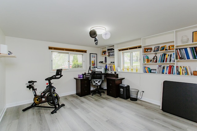 office area featuring baseboards and wood finished floors