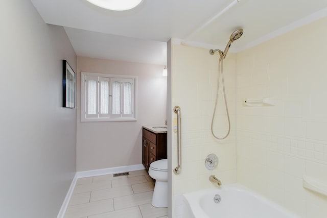 bathroom featuring tile patterned flooring, vanity, toilet, baseboards, and shower / washtub combination