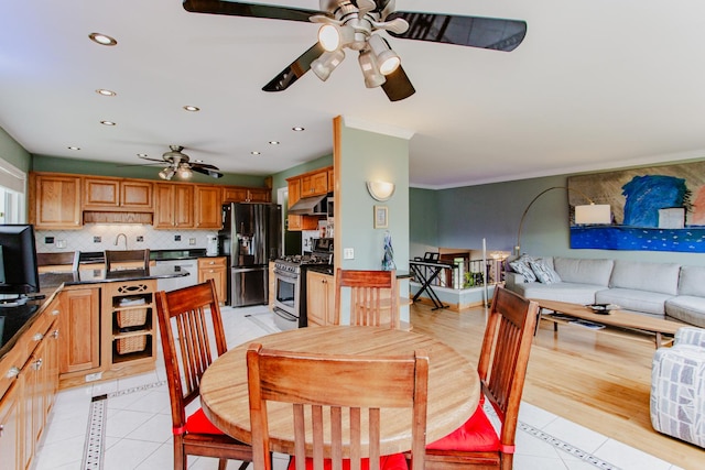dining area featuring recessed lighting, crown molding, ceiling fan, and light tile patterned flooring