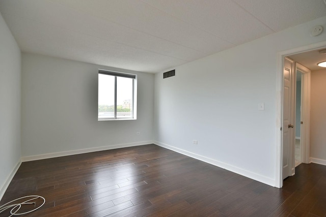 110 W Butterfield Rd Unit 214S, Elmhurst, IL 60126 - unfurnished room with baseboards, visible vents, and dark wood finished floors
