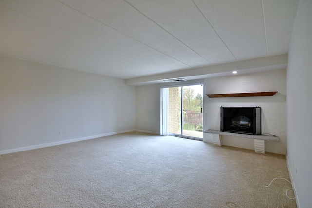 110 W Butterfield Rd Unit 214S, Elmhurst, IL 60126 - unfurnished living room with a brick fireplace, baseboards, visible vents, and carpet floors