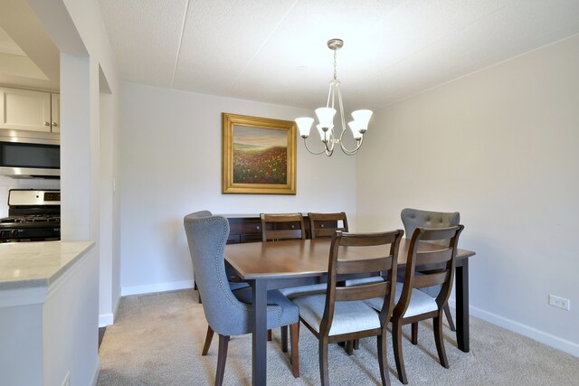 110 W Butterfield Rd Unit 214S, Elmhurst, IL 60126 - dining area with baseboards, light colored carpet, and an inviting chandelier