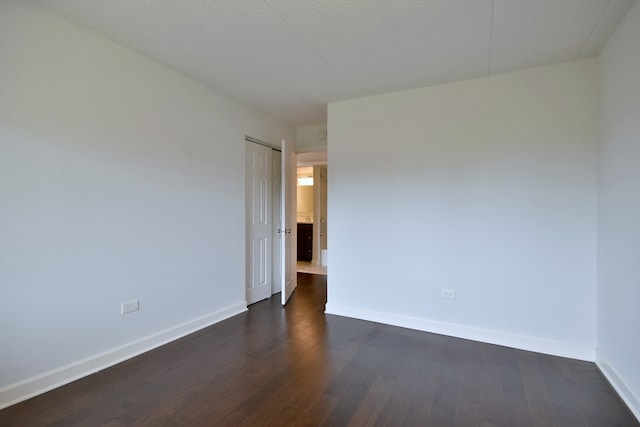 110 W Butterfield Rd Unit 214S, Elmhurst, IL 60126 - empty room with baseboards and dark wood-style floors