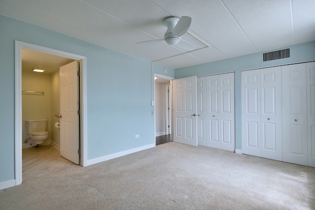 110 W Butterfield Rd Unit 214S, Elmhurst, IL 60126 - unfurnished bedroom featuring visible vents, multiple closets, baseboards, carpet, and ensuite bath