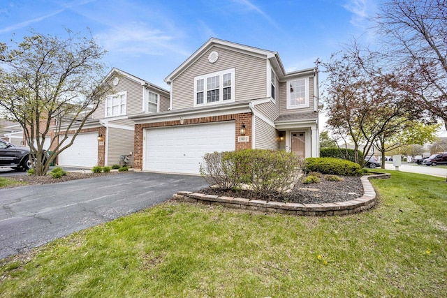 17412 Fox Bend Ln, Lockport, IL 60441 - view of front of house with brick siding, driveway, a front lawn, and a garage