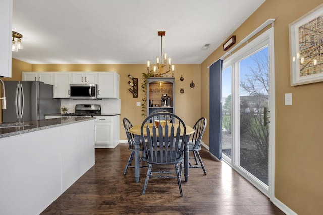 17412 Fox Bend Ln, Lockport, IL 60441 - dining room with baseboards, a notable chandelier, dark wood-style floors, and visible vents