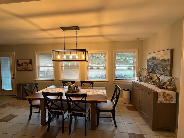dining room with light tile patterned flooring and a wealth of natural light