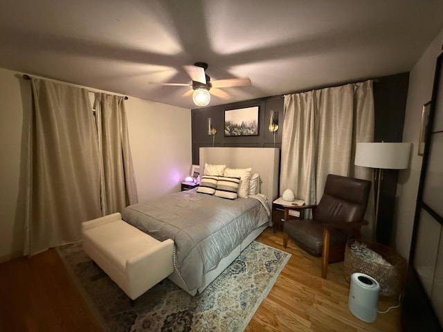 bedroom with a ceiling fan and light wood finished floors