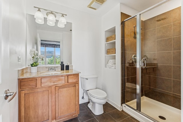 1228 W Monroe St Unit 301, Chicago, IL 60607 - full bath with a stall shower, toilet, tile patterned floors, and vanity