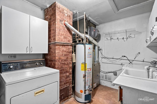 339 3rd St, Downers Grove, IL 60515 - clothes washing area featuring light tile patterned floors, a sink, cabinet space, water heater, and washer / clothes dryer