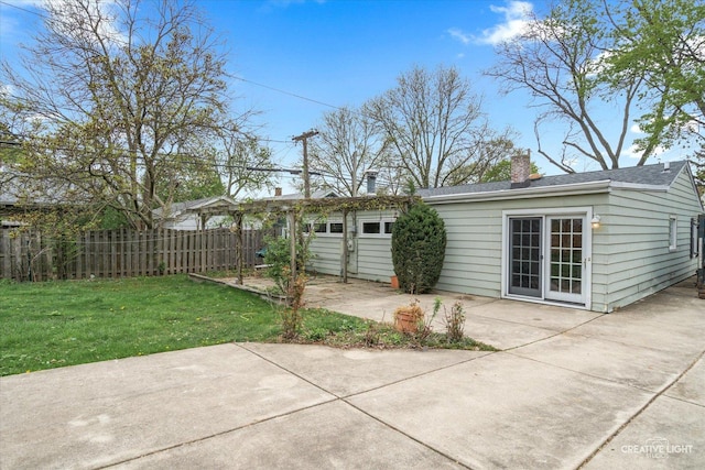 339 3rd St, Downers Grove, IL 60515 - rear view of property featuring fence, a patio, a chimney, and a lawn