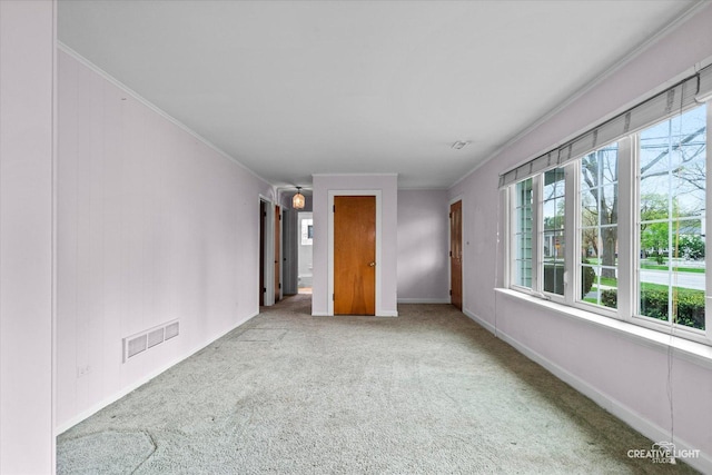 339 3rd St, Downers Grove, IL 60515 - empty room with baseboards, ornamental molding, visible vents, and carpet