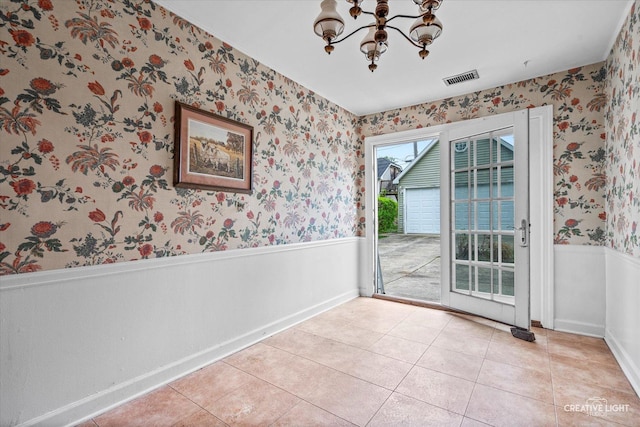 339 3rd St, Downers Grove, IL 60515 - unfurnished dining area featuring wallpapered walls, light tile patterned floors, an inviting chandelier, wainscoting, and visible vents