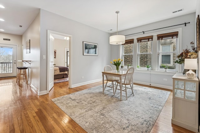 dining space featuring visible vents, recessed lighting, baseboards, and wood finished floors