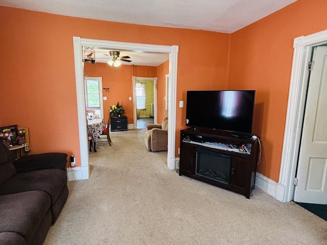 458 Morgan St, Elgin, IL 60123 - living room featuring carpet, a textured ceiling, and a ceiling fan