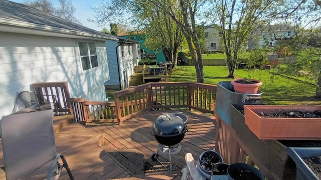 wooden deck with a lawn