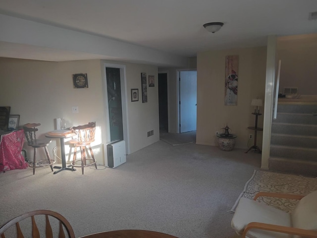 carpeted living area with visible vents