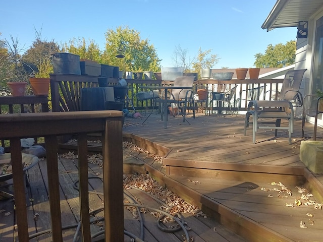 wooden deck featuring outdoor dining space