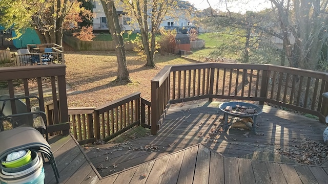 deck featuring fence and an outdoor fire pit