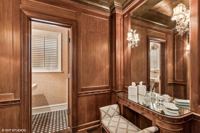 interior space with wooden walls and ornamental molding