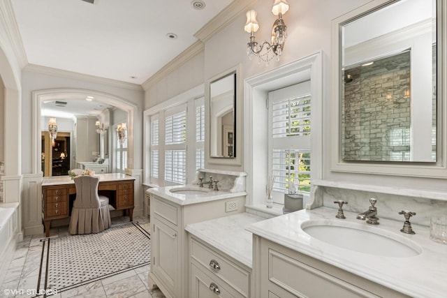 full bath featuring marble finish floor, crown molding, a sink, and tiled shower