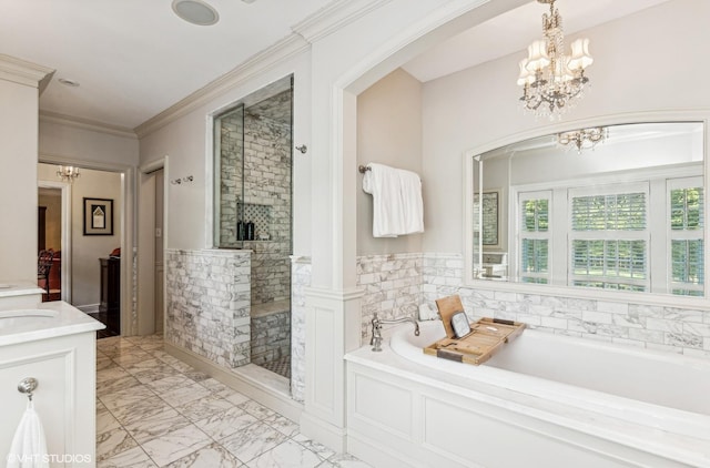 bathroom with a bath, wainscoting, a shower stall, and a notable chandelier