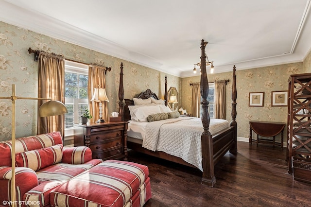 bedroom with crown molding, wood finished floors, and wallpapered walls