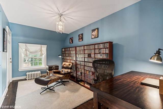 office space with vaulted ceiling, wood finished floors, a chandelier, radiator, and baseboards