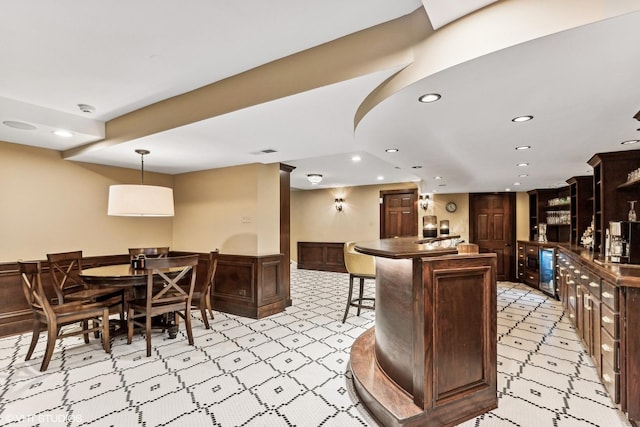 kitchen with dark countertops, visible vents, and recessed lighting