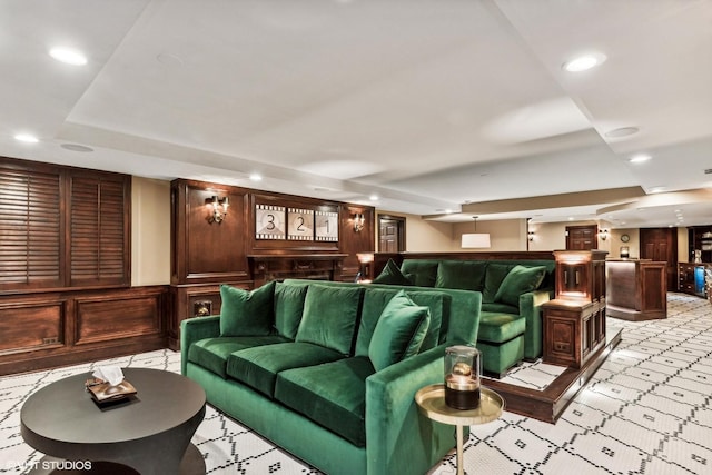 home theater room with a dry bar, a tray ceiling, and recessed lighting