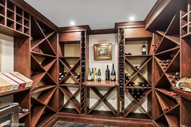 wine room featuring ornamental molding