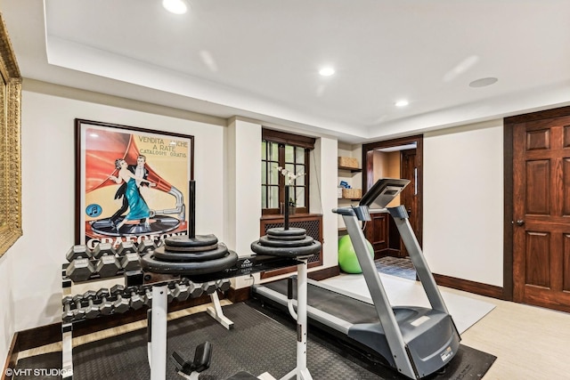 workout room featuring baseboards and recessed lighting