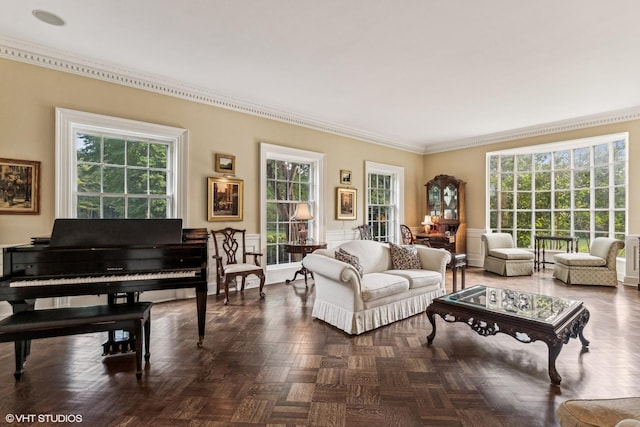 living room featuring a wainscoted wall and ornamental molding