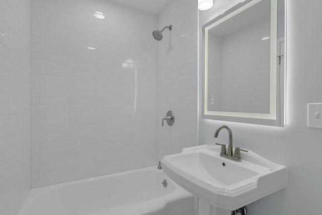 full bath featuring bathtub / shower combination and a sink