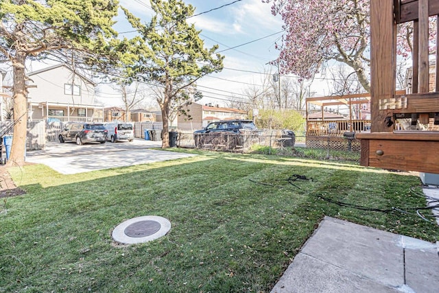 view of yard featuring a residential view and fence