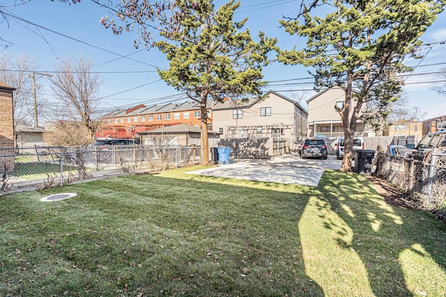 view of yard with a residential view and fence