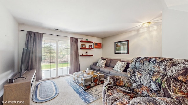 living room with carpet flooring and visible vents