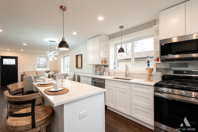 9106 S Eggleston Ave, Chicago, IL 60620 - kitchen with open shelves, stainless steel appliances, a sink, and white cabinetry