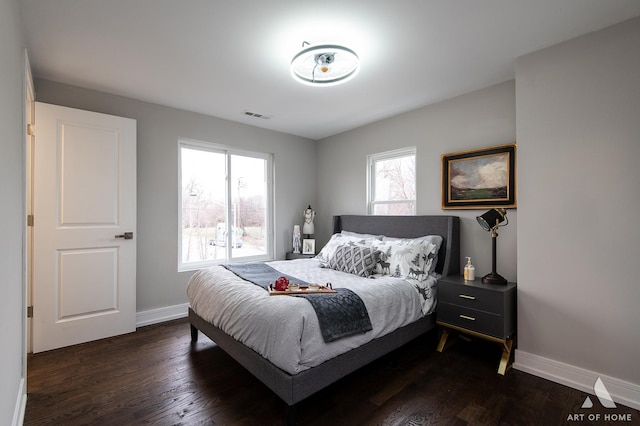 9106 S Eggleston Ave, Chicago, IL 60620 - bedroom featuring baseboards, visible vents, and dark wood-style floors
