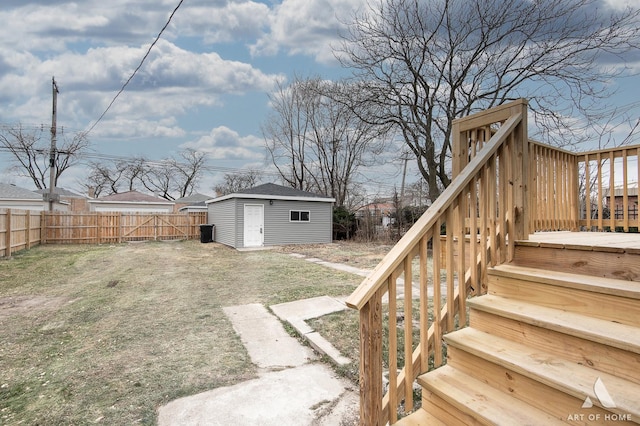 9106 S Eggleston Ave, Chicago, IL 60620 - view of yard featuring a fenced backyard, an outdoor structure, a wooden deck, stairs, and a storage unit
